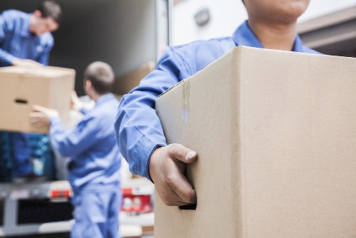 Professional flat removals in Bayswater with packed boxes and moving van