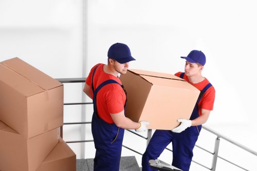 Furniture removal team loading bulky items during a Bayswater pick-up
