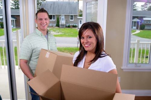 Moving boxes and furniture prepared for a home move in Bayswater