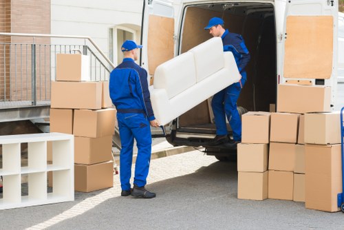 Professional team collecting old sofas and tables in Bayswater