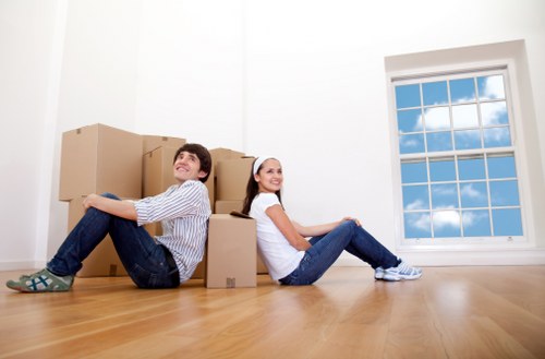 Commercial moving team transporting office furniture in Bayswater