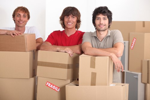 Packed boxes and furniture arranged inside a removal van