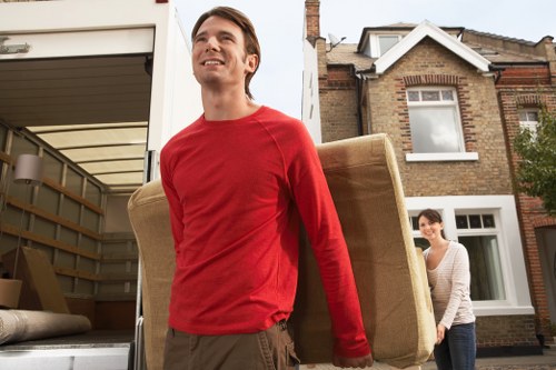 Movers handling furniture carefully during a professional relocation service