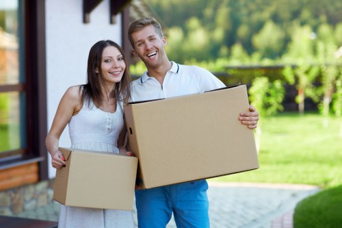 Trained movers handling boxes and furniture with care in Bayswater