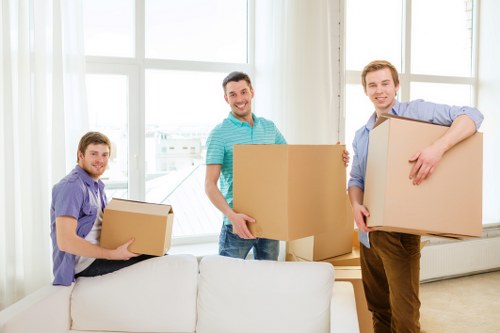 Trained removal workers using safe lifting techniques