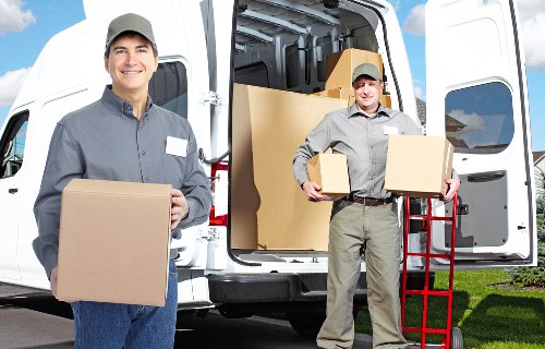 Grand piano being prepared for safe transport by experienced movers