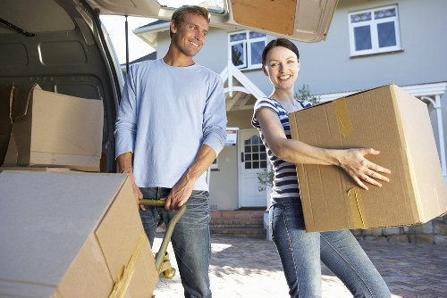 Packed boxes and wrapped furniture for moving day